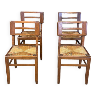 Set of 4 modernist chairs Pierre Cruege dark wood and straw 50s France