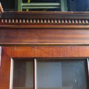 Scribanne bookcase in mahogany veneer English work of the twentieth century