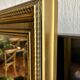 Large antique beveled mirror in the Napoleon III style - Gold and black frame