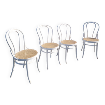 Set of 4 turned wooden chairs with caning.