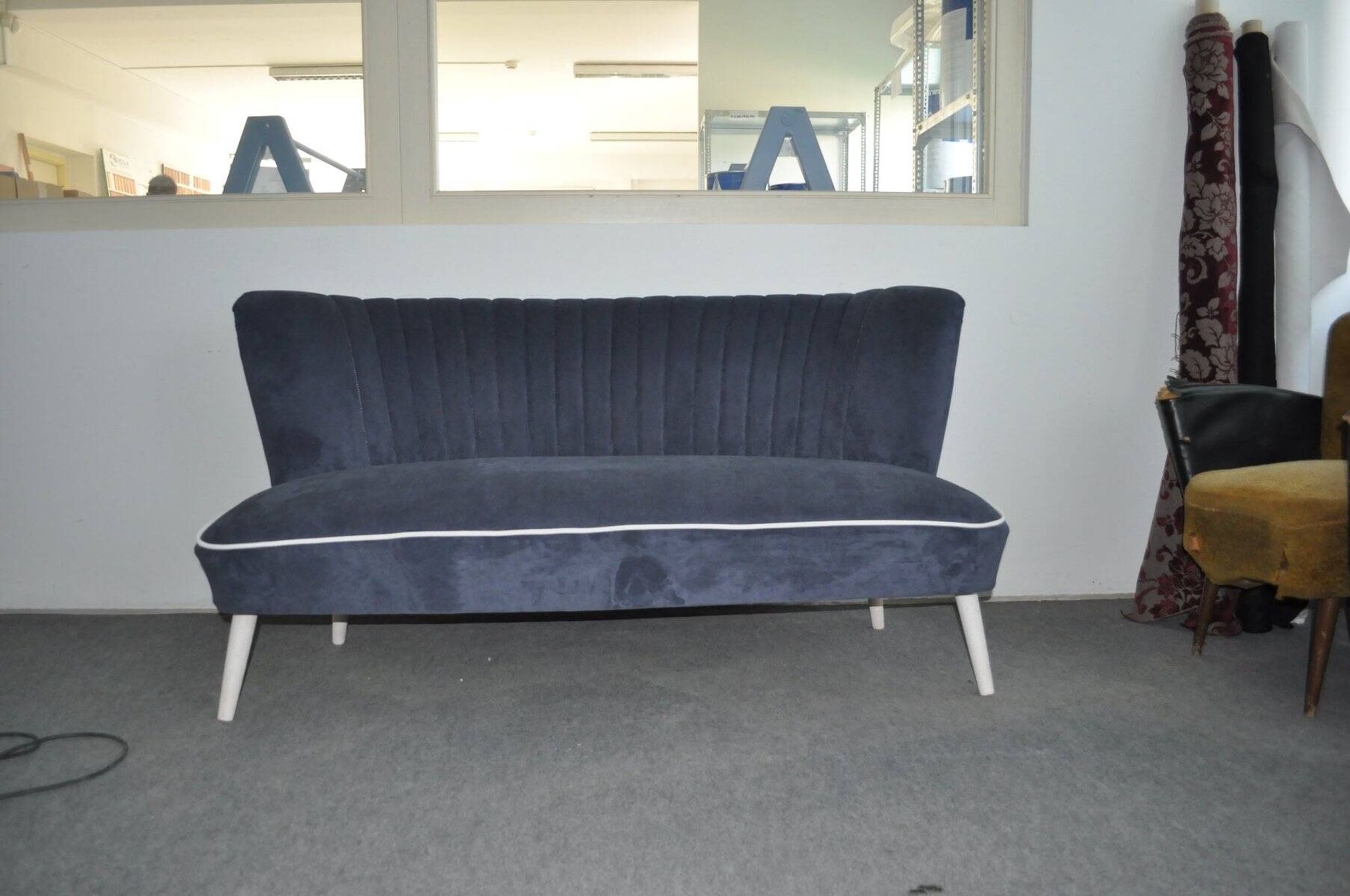 Blue fabric cocktail canapé with beech legs, 1950s style.