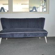 Blue fabric cocktail canapé with beech legs, 1950s style.