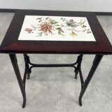 Nested tables in curved wood with ceramic top by Thonet.