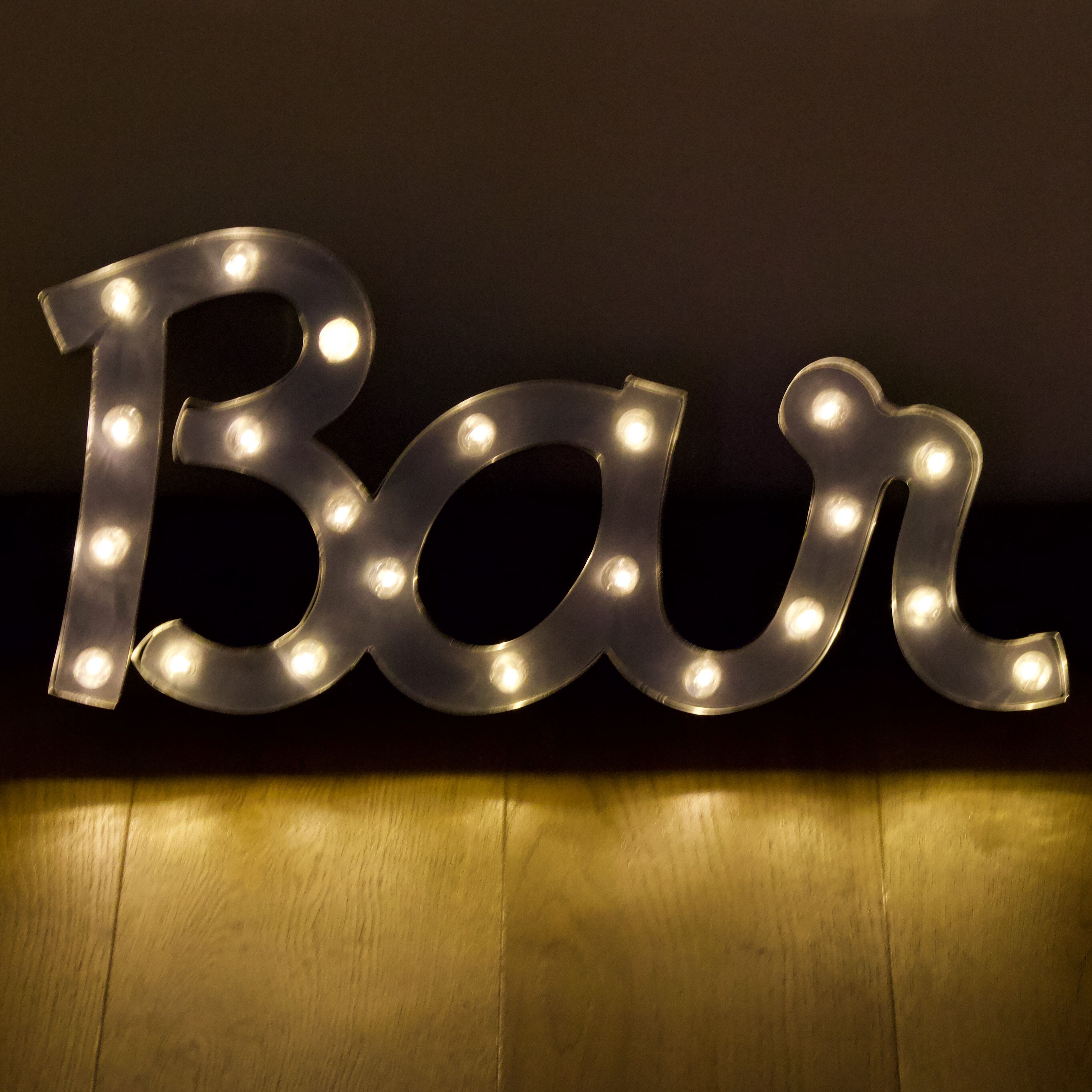 Ancient Light Sign in aluminium lettering forming the word "BAR"