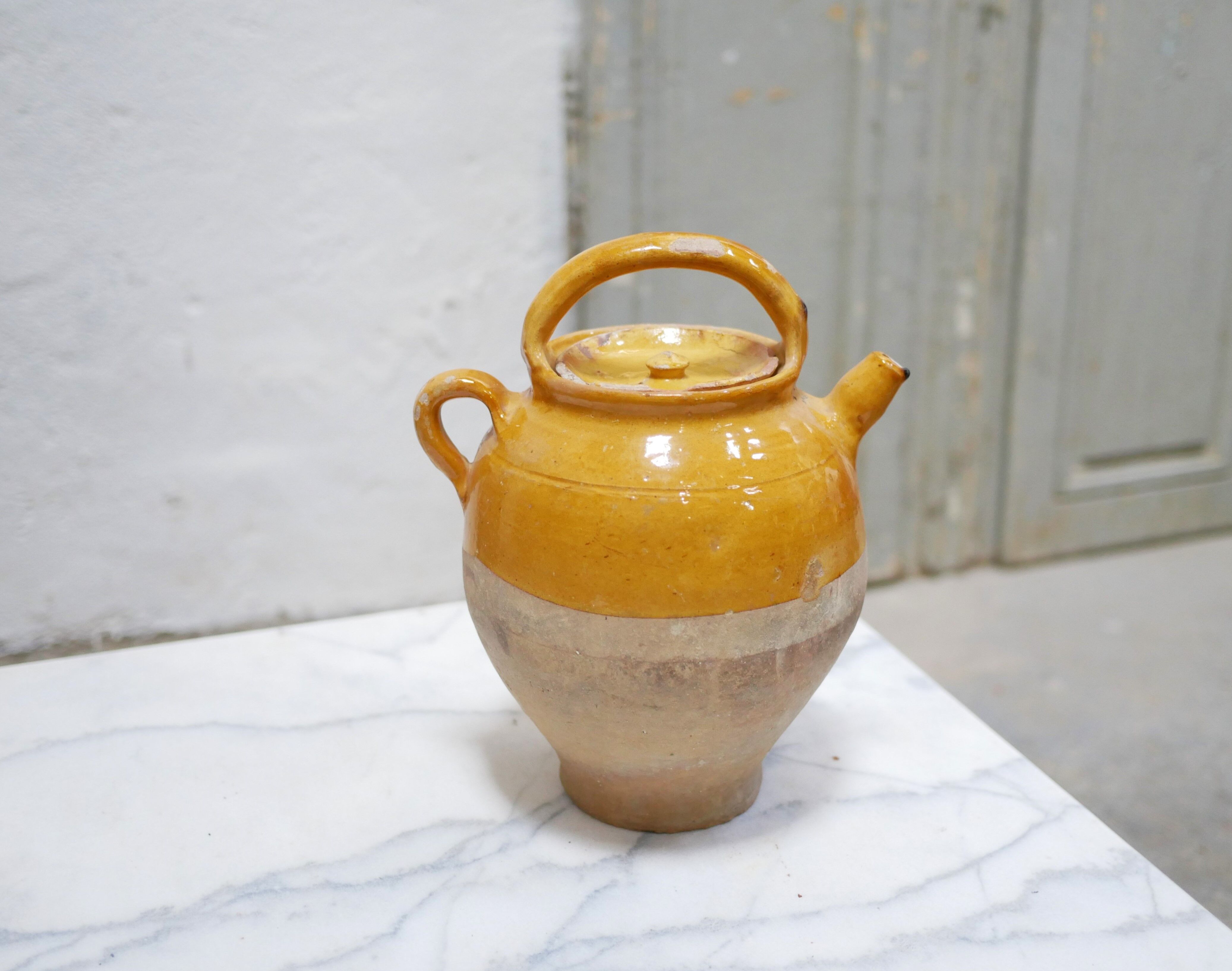 Old gargoulette pot in glazed terracotta