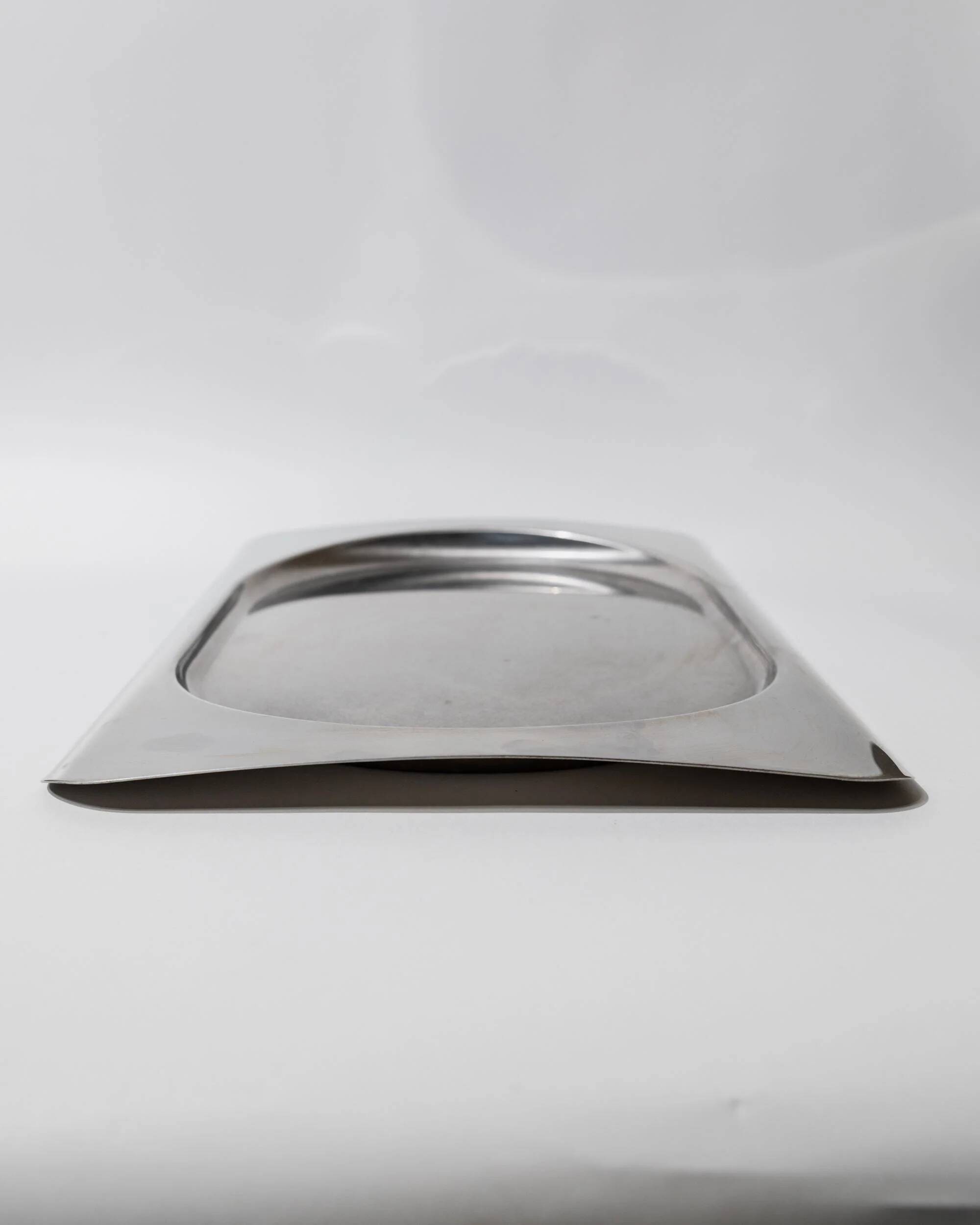 1990s vintage stainless steel platter, rectangular with an oval indentation, minimalist modern design.