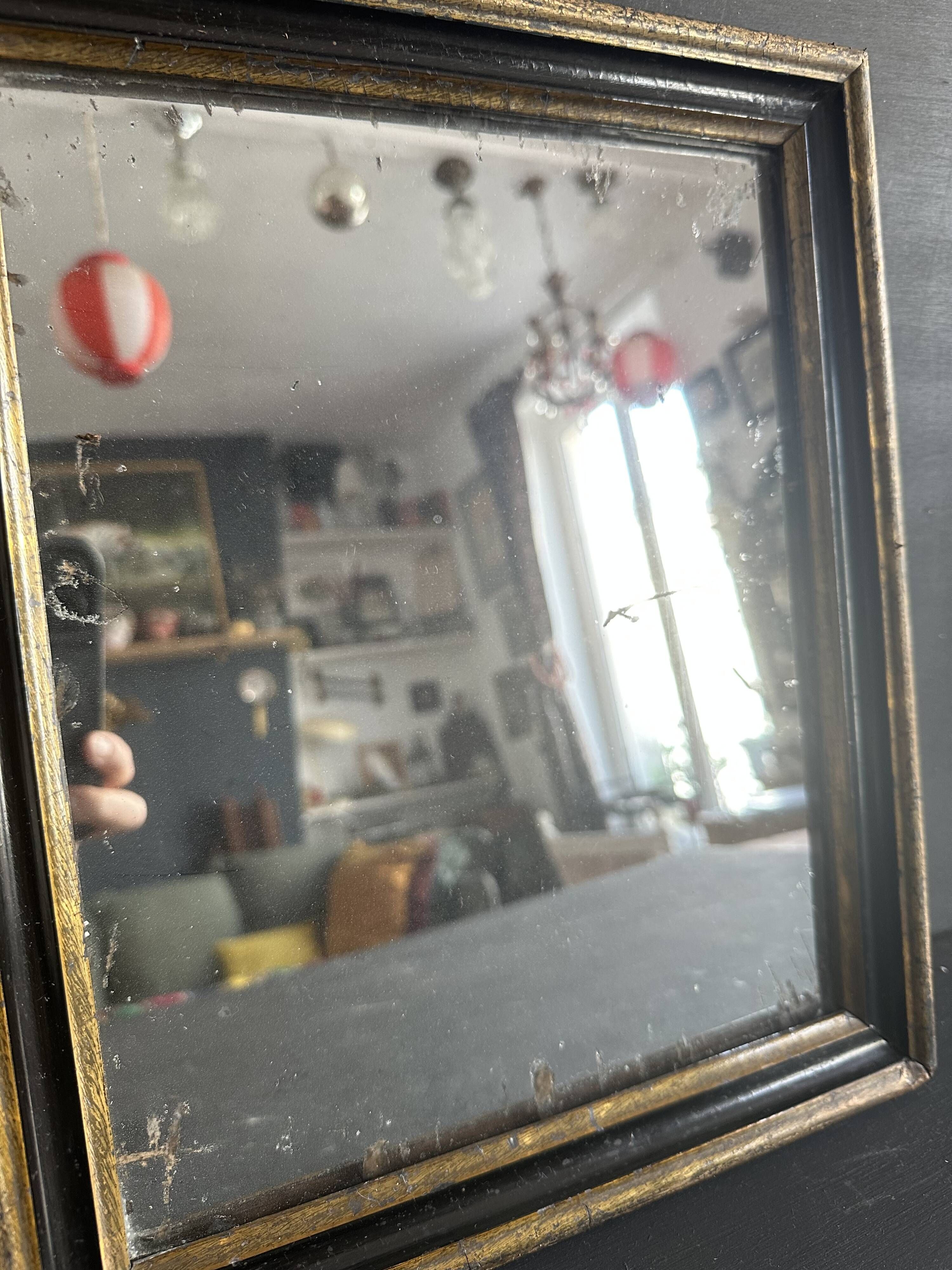 Miroir Napoléon III en bois noir et doré, XIXe siècle