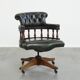 Adjustable green leather and wood Chesterfield office chair with swivel