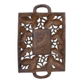 Small wooden tray cut out with leaf patterns