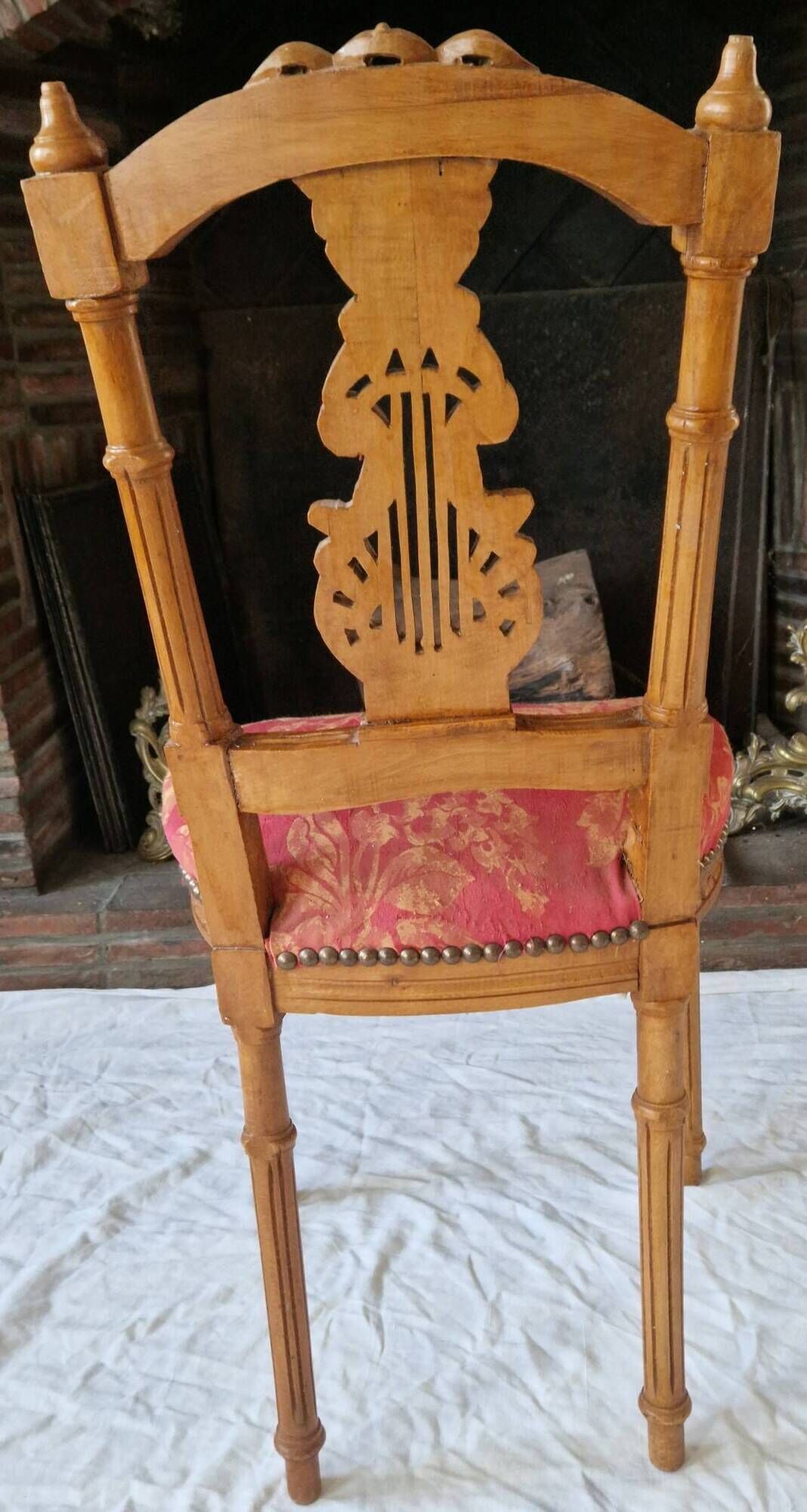 Lyre back chair in carved wood, Louis XVI style, late 19th century.