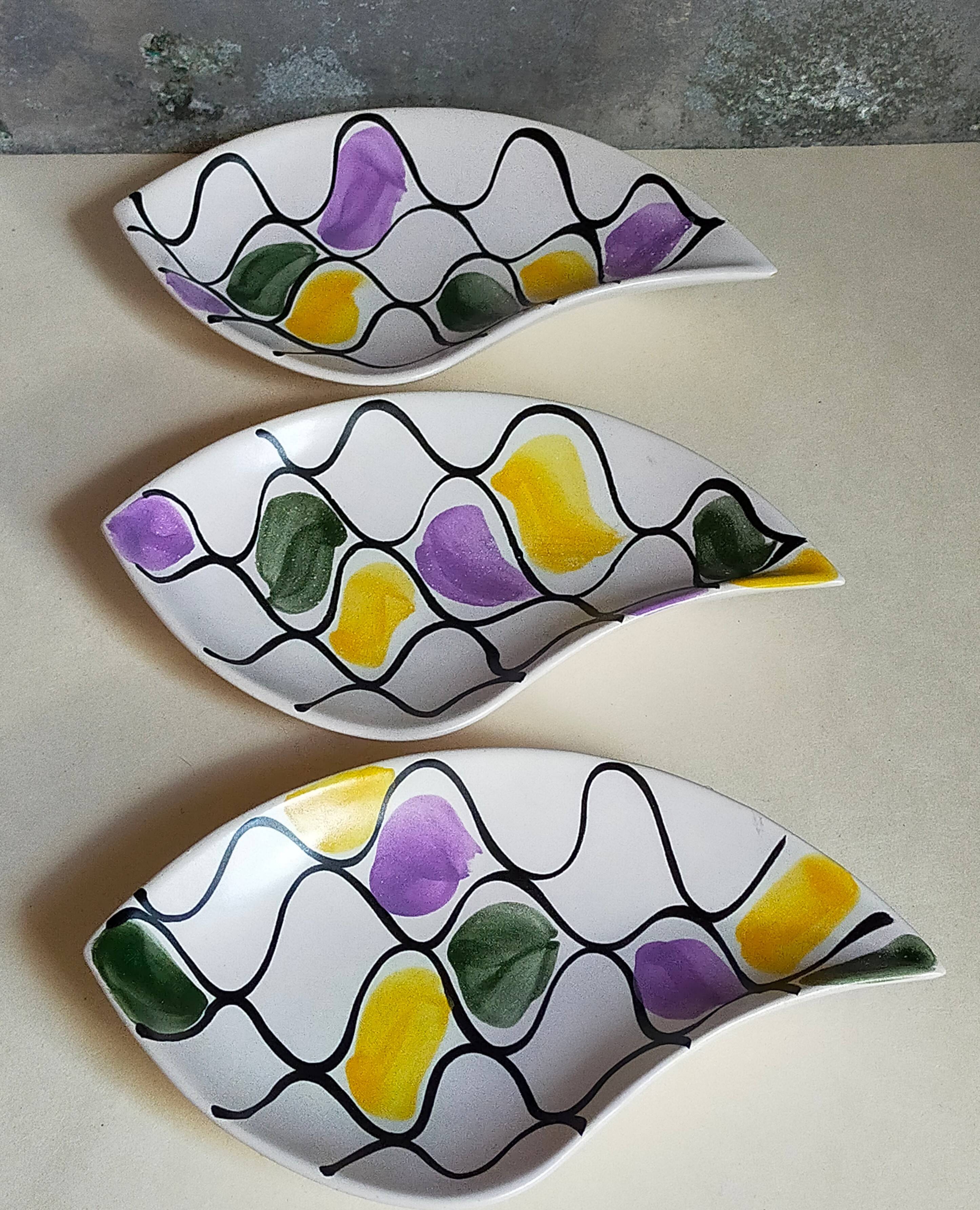Three vintage free-form ceramic ravine dishes from the 1950s