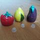 Trio salt shakers pepper vegetables and fruits in slip