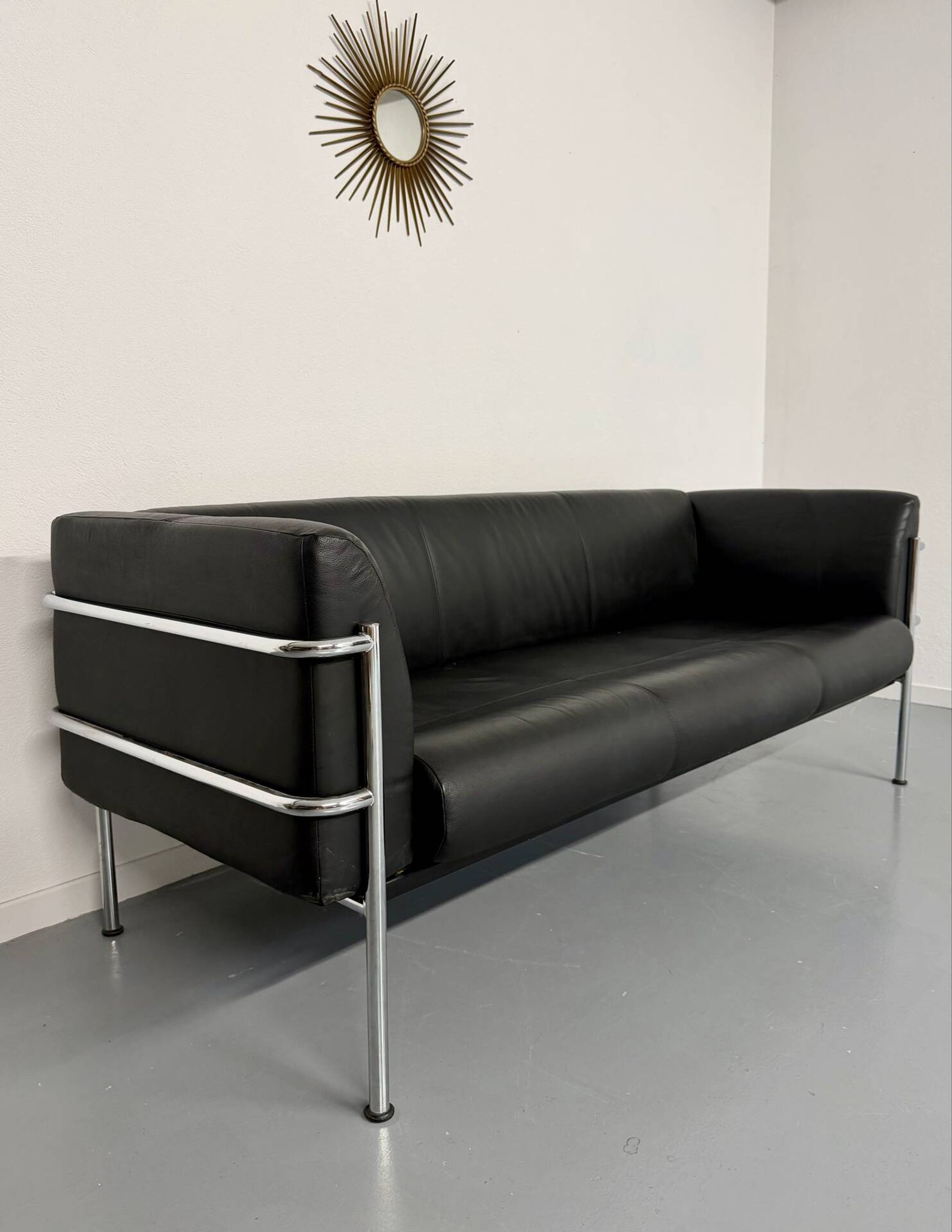 Three-seater tubular chrome and black leather sofa by Kébé, Denmark 80