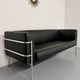 Three-seater tubular chrome and black leather sofa by Kébé, Denmark 80