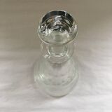 Carafe with chiseled floral decoration