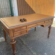 Double-sided flat desk in Louis XVI style made of mahogany and leather.