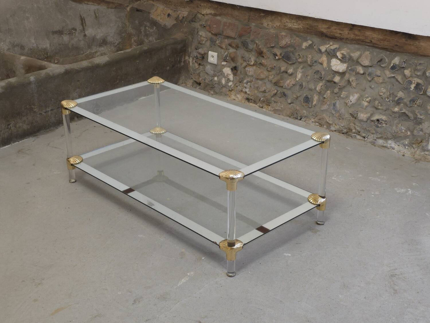 Coffee table, living room table in glass with two tiers, adorned with golden seashells, 1970.