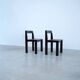 Set of eight black lacquered dining chairs