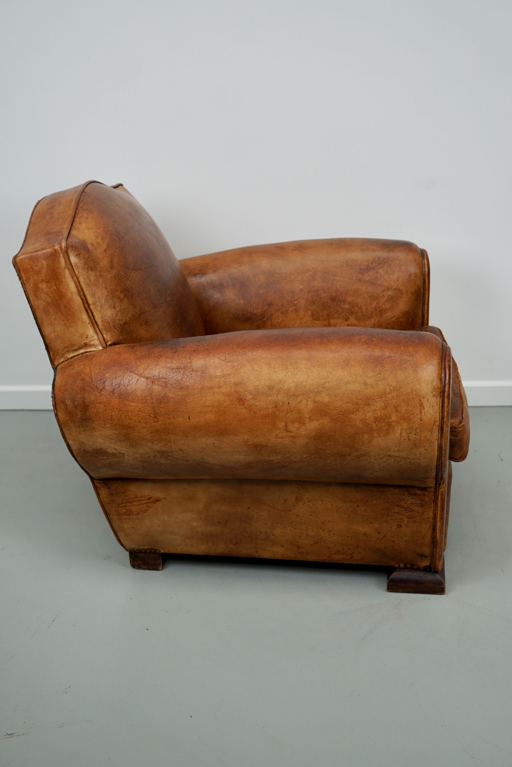 French moustache back cognac-colored leather club chair, 1940s