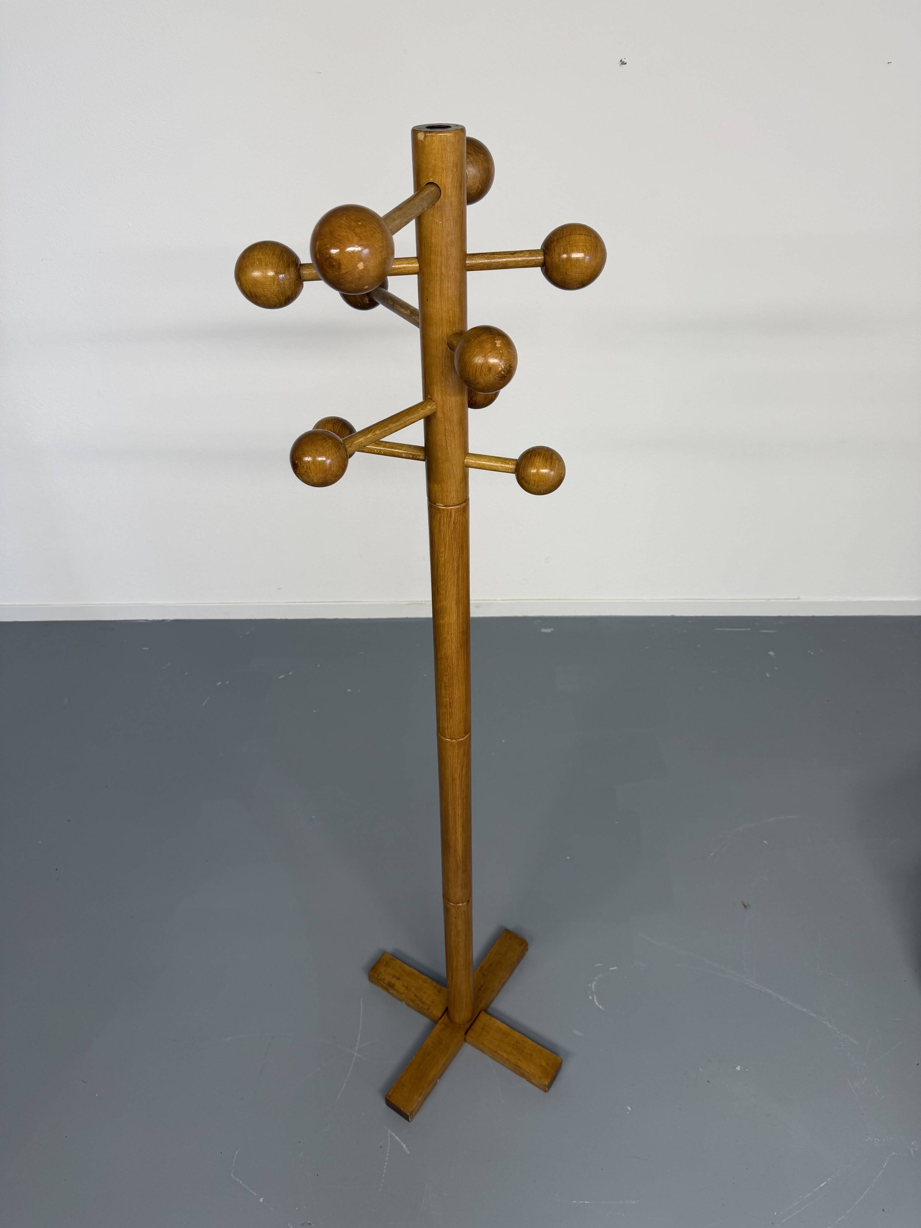 Vintage wooden coat stand with modernist design from the 1970s.