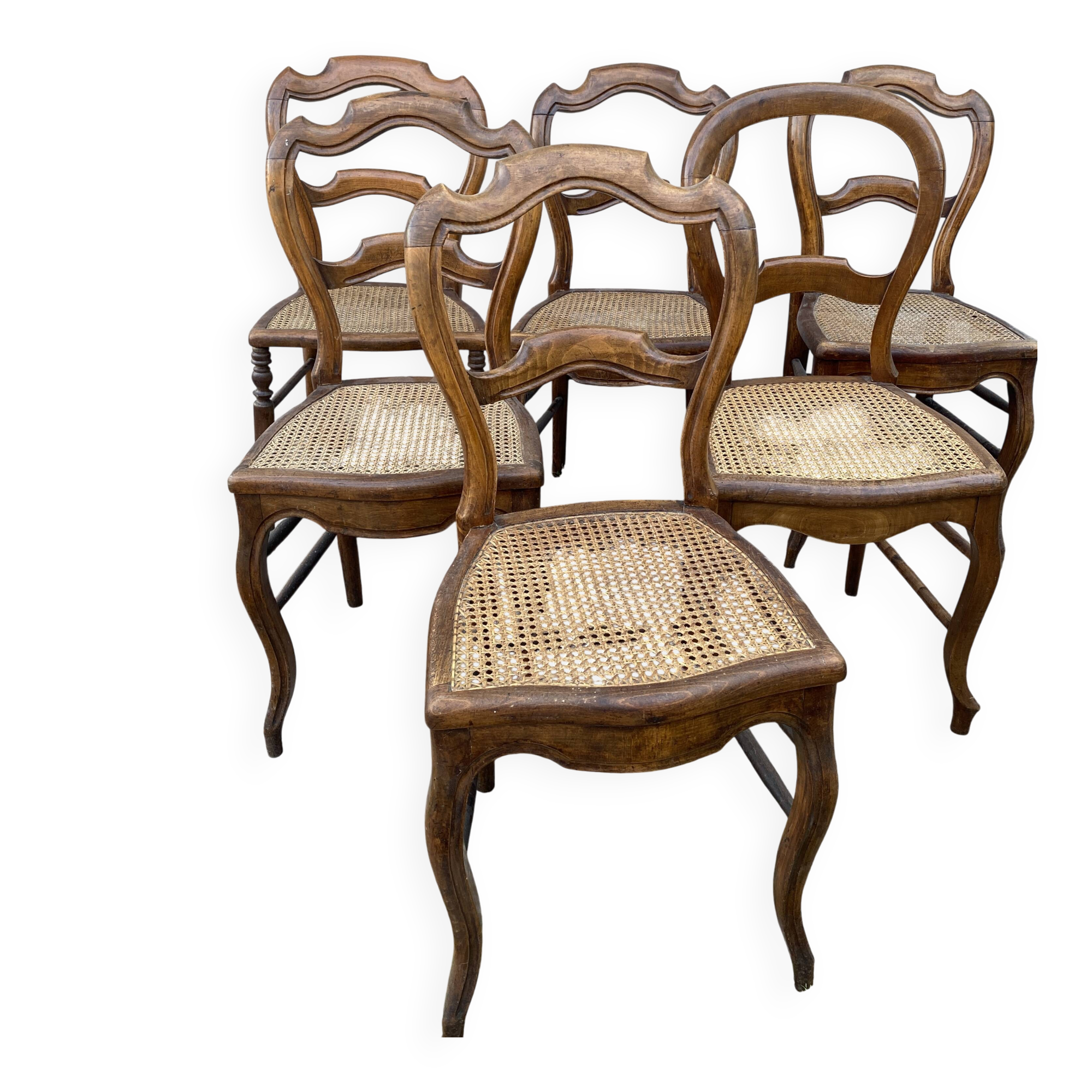 6 mismatched cane chairs
