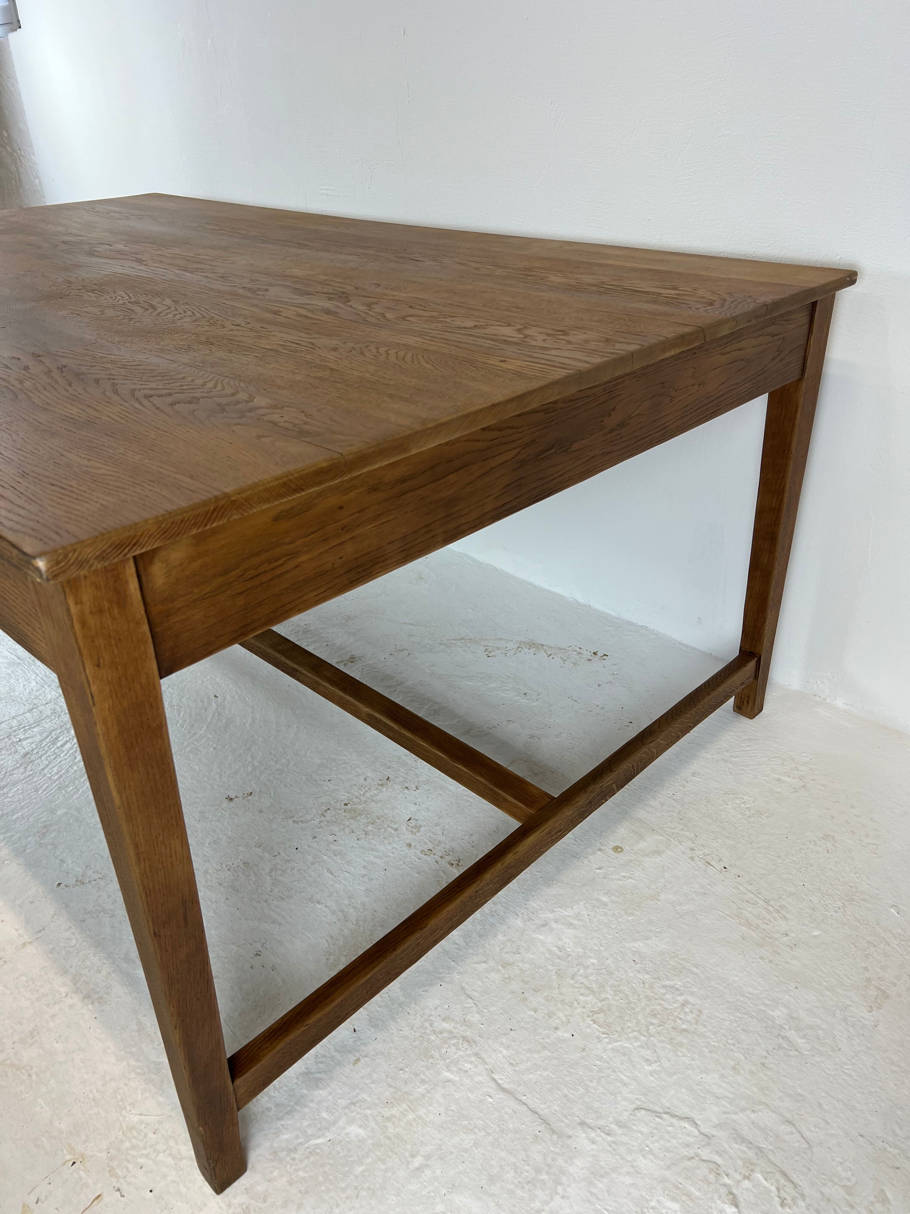 Two-sided oak work table, with 4 drawers