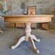 Round cherry table with 2 extensions.
