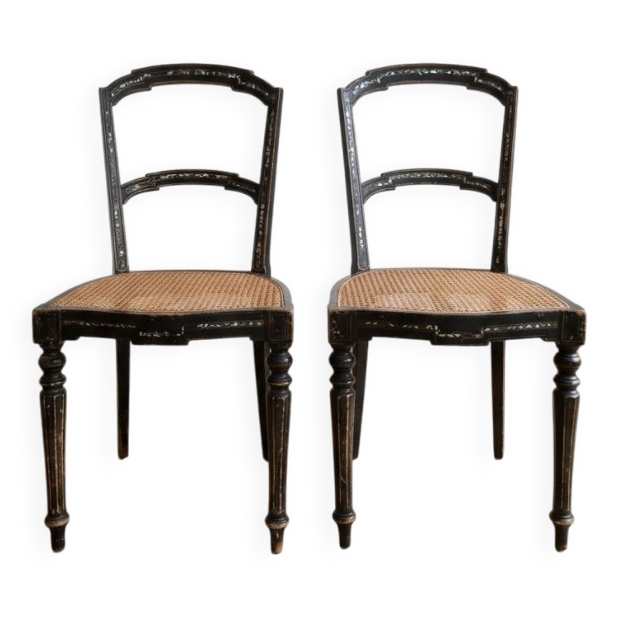 Set of 2 antique chairs in blackened wood and caned.