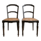 Set of 2 antique chairs in blackened wood and caned.