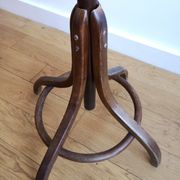 Dark wooden parrot coat holder