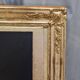 19th-century gilded trumeau mirror with restaurant slate.