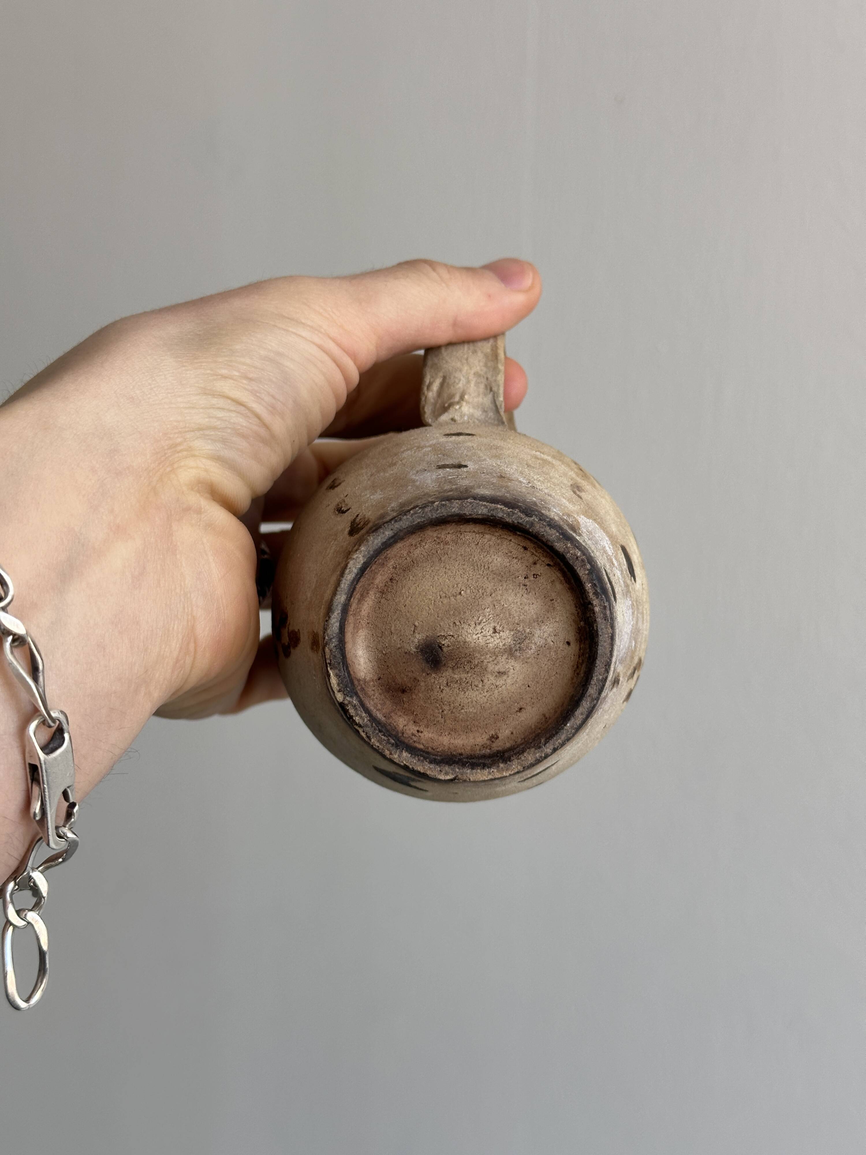 Small old terracotta cup