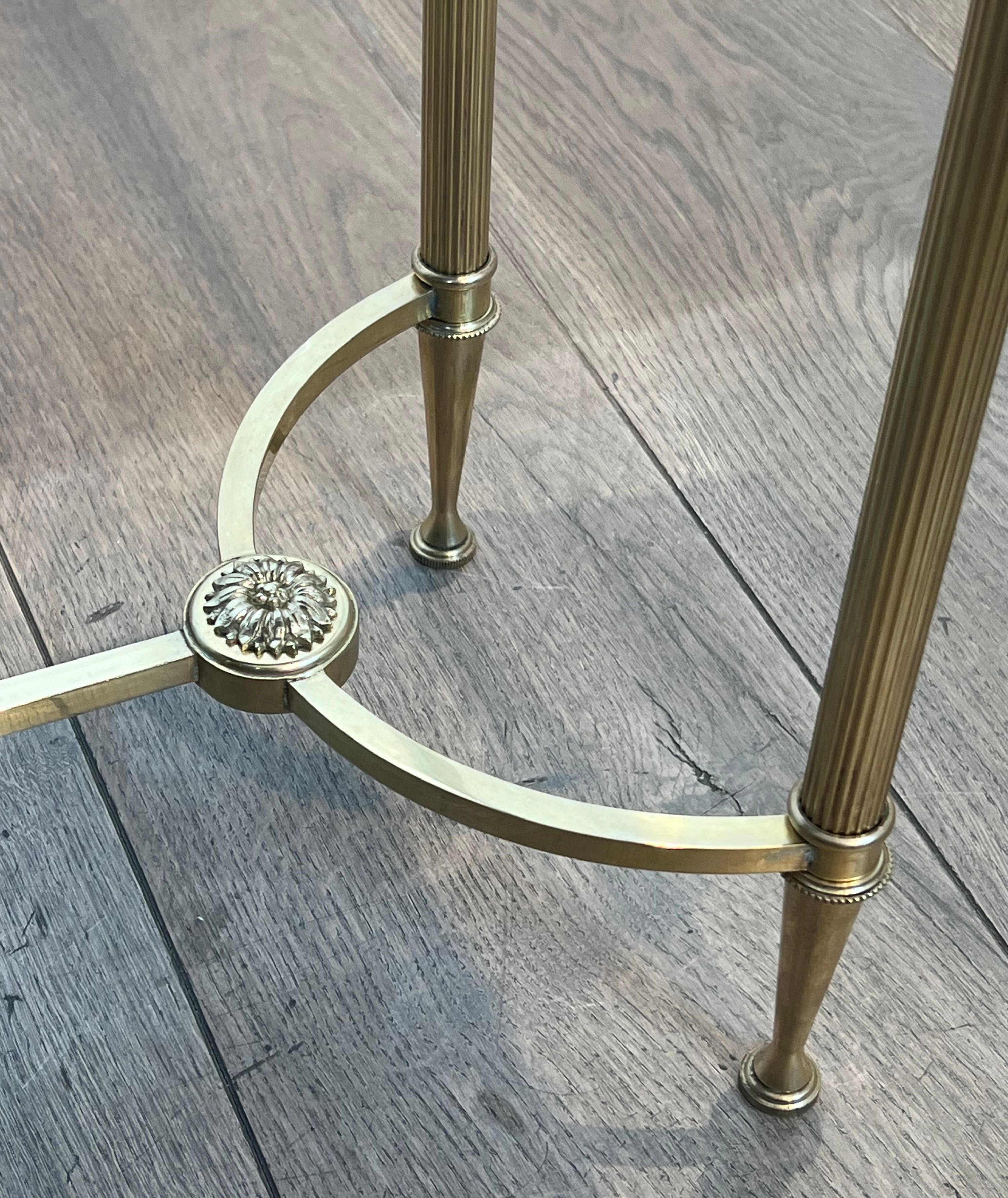 Pair of brass and antique mirror side tables from the Baguès house.