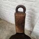 Antique tripod chair in solid wood and animal skin.