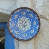 Decorative plate in blue enameled metal with bird motifs