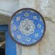 Decorative plate in blue enameled metal with bird motifs