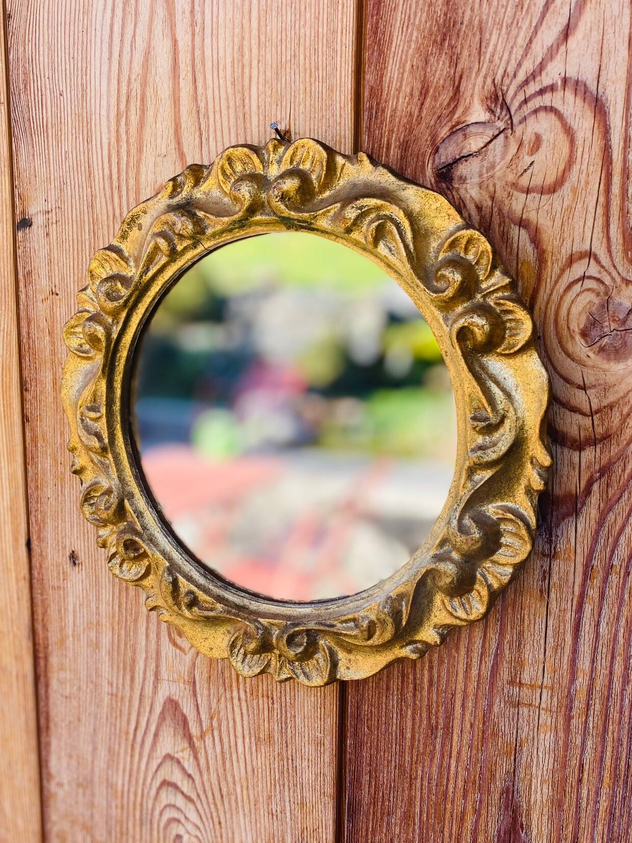 Small round antique gold mirror