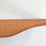 Canapé des années 60, en teck et bouclé blanc.