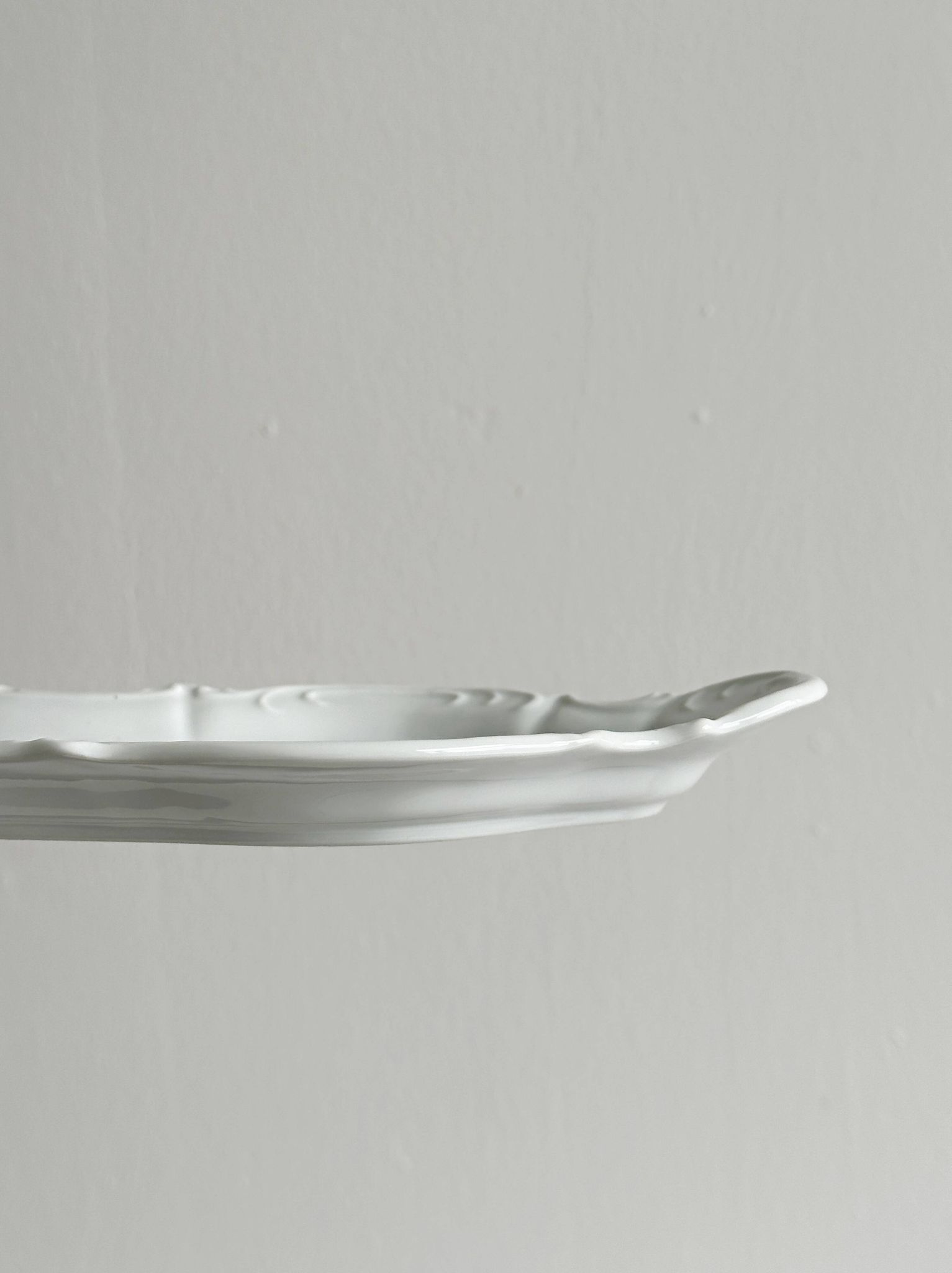 white porcelain plate in an unusual shape
