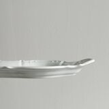 white porcelain plate in an unusual shape