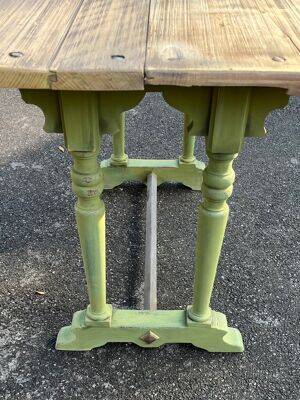 Old table with patinated green legs