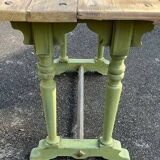Old table with patinated green legs