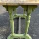 Old table with patinated green legs