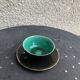 Coffee service composed of 5 cups and saucers in black earthenware and different colored interiors