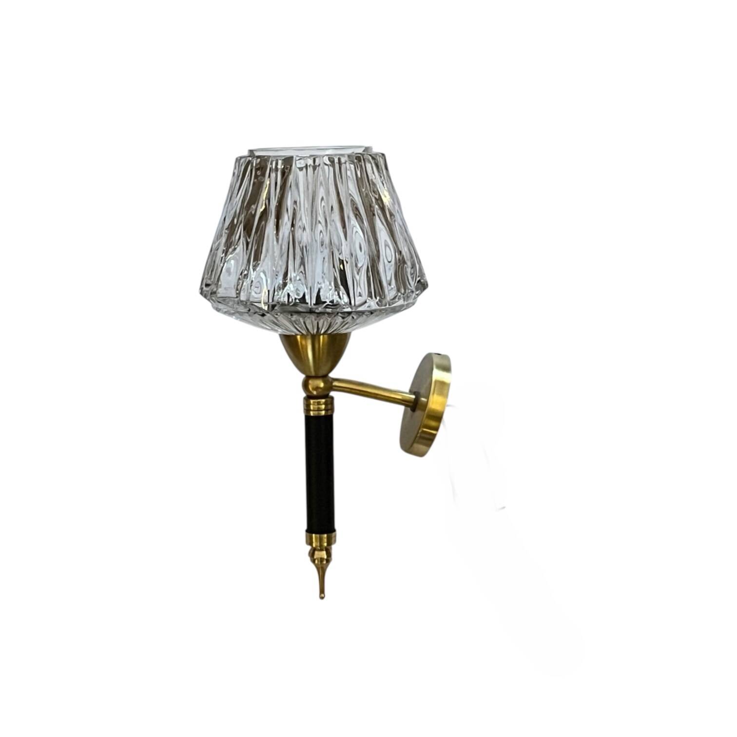 Vintage wall sconce torch in brass, thick glass globes.