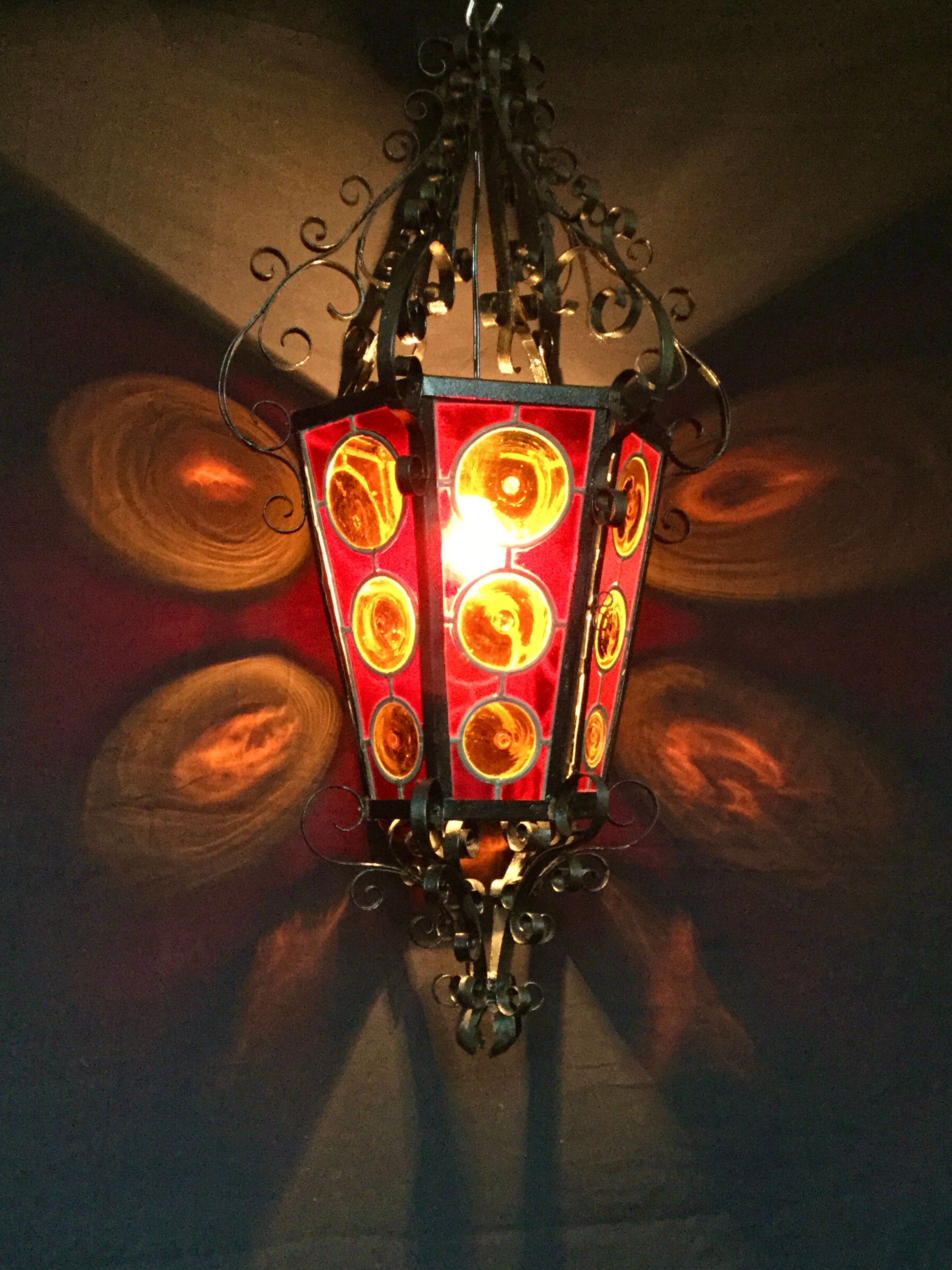 Wrought iron lantern and stained glass windows