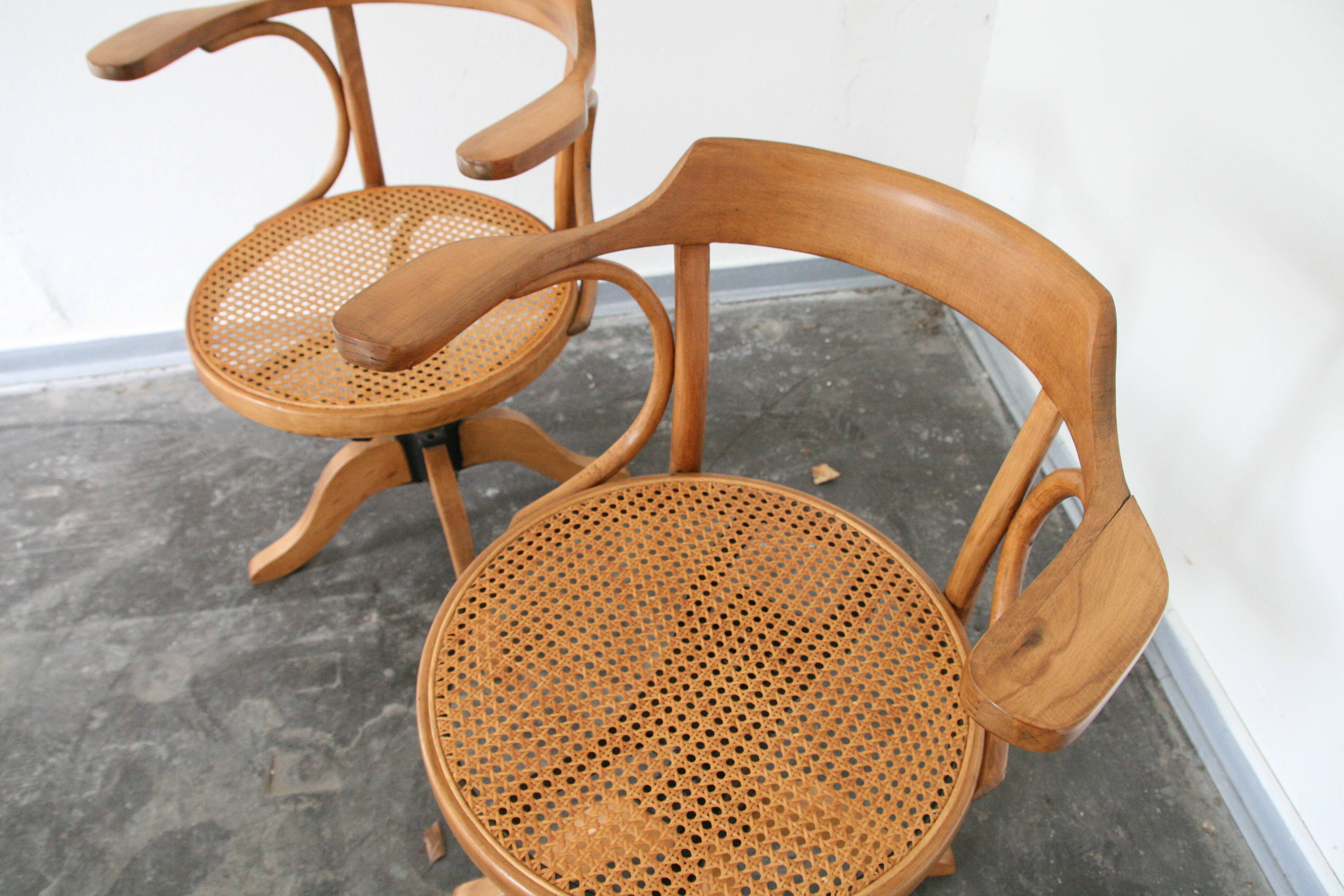 A pair of vintage bent wood svivel chairs by Salvaatore Leone Italy