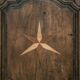 Antique French rustic wardrobe with star inlays.