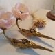 Pair of bronze swan and pink tulip wall lights in glass paste
