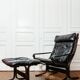 Siesta armchair and black leather ottoman by Ingmar Relling for Westnofa, Norway.